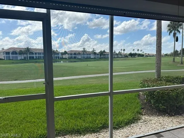 Unfurnished sunroom with view of golf course