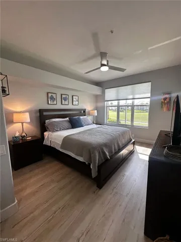 Bedroom featuring wood finished floors and a ceiling fan