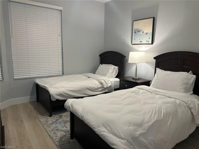 Bedroom with wood finished floors