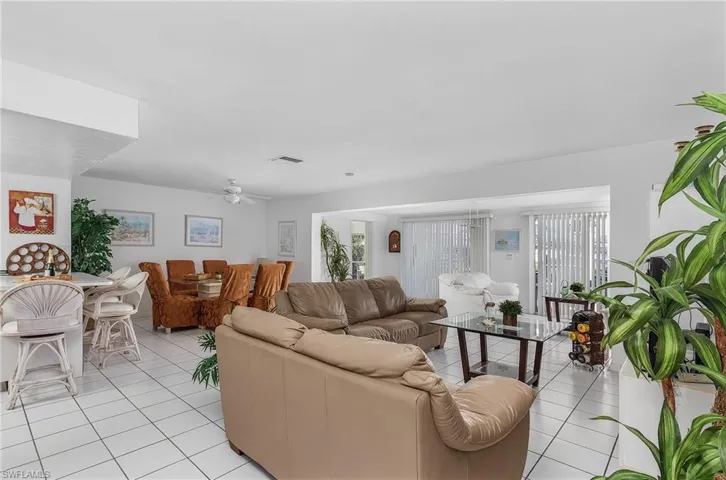 Tiled living room with ceiling fan