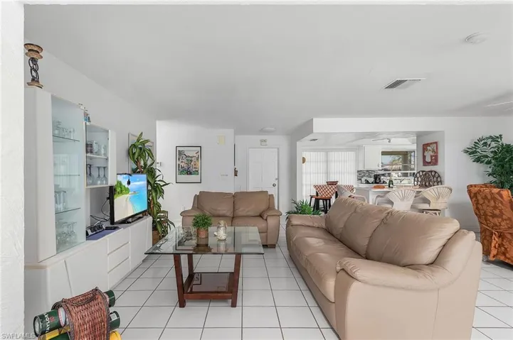 Living room with light tile floors
