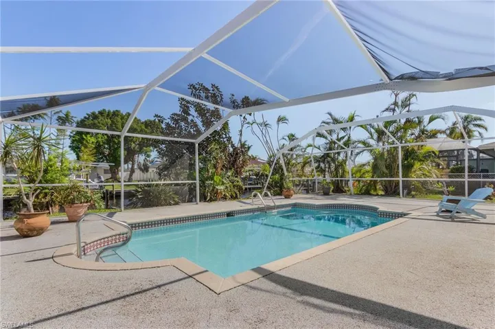 View of pool featuring a patio and a lanai
