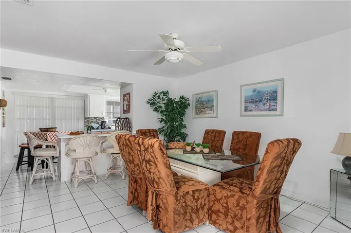 Tiled dining space with ceiling fan