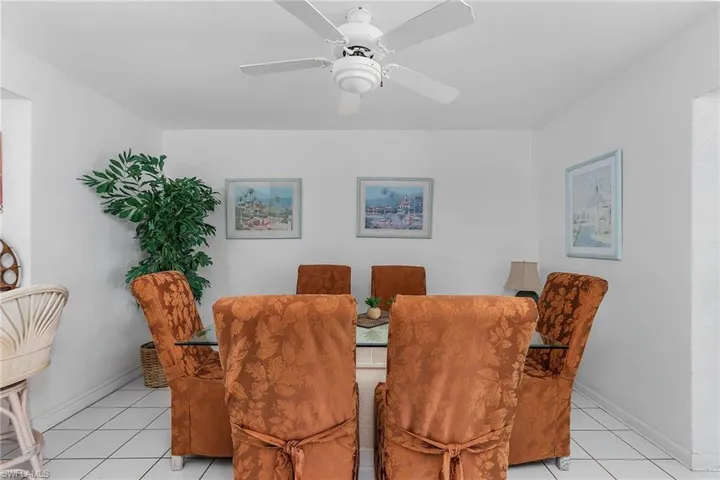 Tiled dining space with ceiling fan