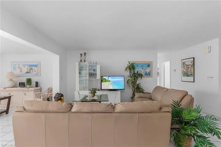 Living room featuring light tile flooring