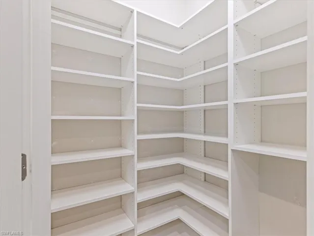 View of pantry with custom shelving