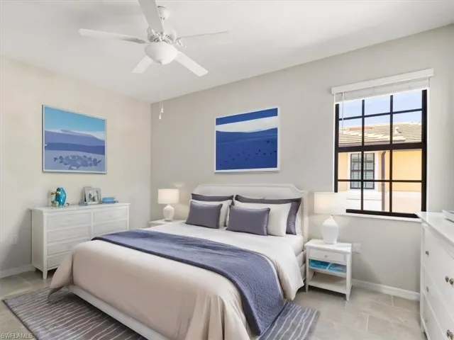 Guest Bedroom featuring ceiling fan and light tile floors, virtually staged