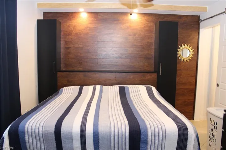 Bedroom with wooden walls