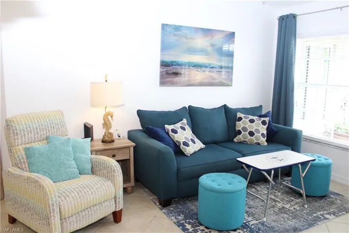 Tiled living room with a healthy amount of sunlight