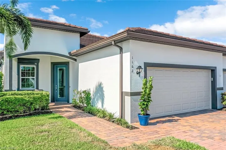 View of front facade featuring a garage