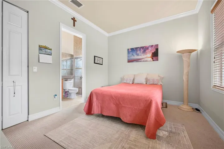 Neutral-toned walls complement the light-colored carpeting throughout this room
