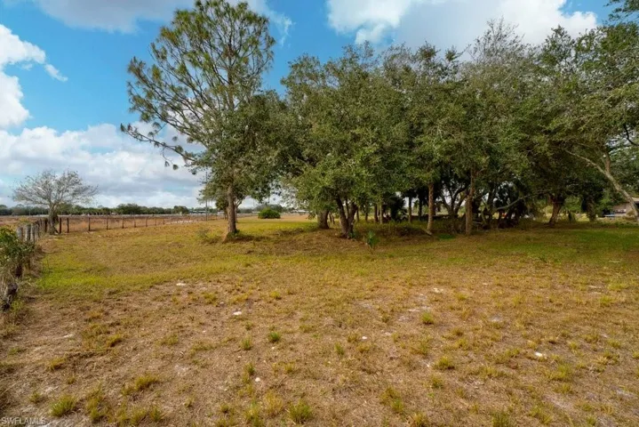 View of yard with a rural view