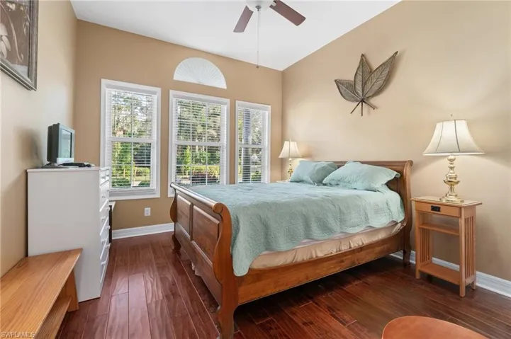 What a beautiful and welcoming guest bedroom - with hardwood floors, high ceilings, and expansive views!