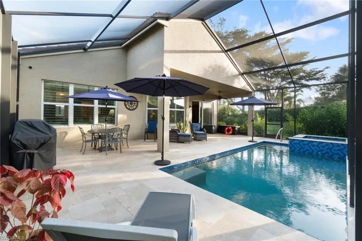 Note the elevated roof line and private/corner side yard beyond the heated spa.