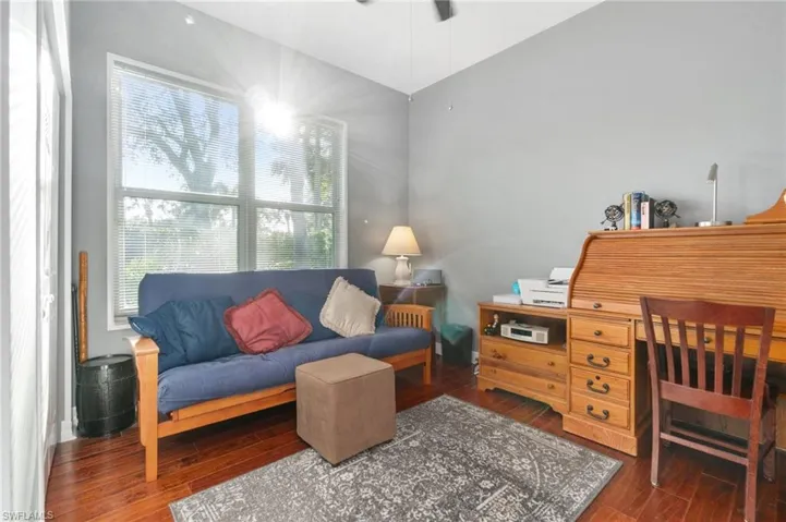 Guest Bedroom (closet is on the left) with large windows looking onto private, wide bush and tree lined side yard.
