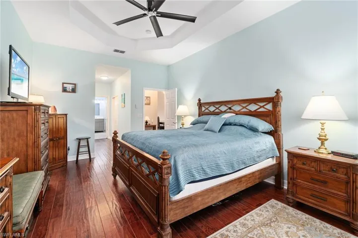 Spacious, elegant Master Bedroom with impeccable hardwood flooring, beautiful ceiling treatment and top of the line modern overhead fan.