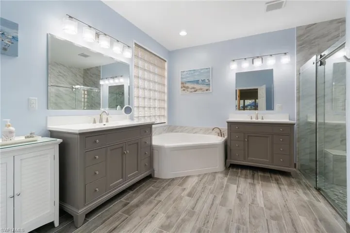Room for storage or decorator piece in the large master bath.