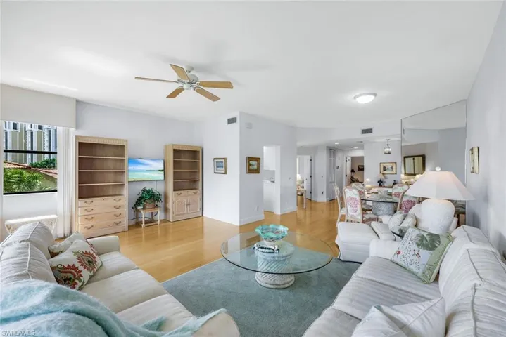 Living room featuring wood finished floors and a ceiling fan