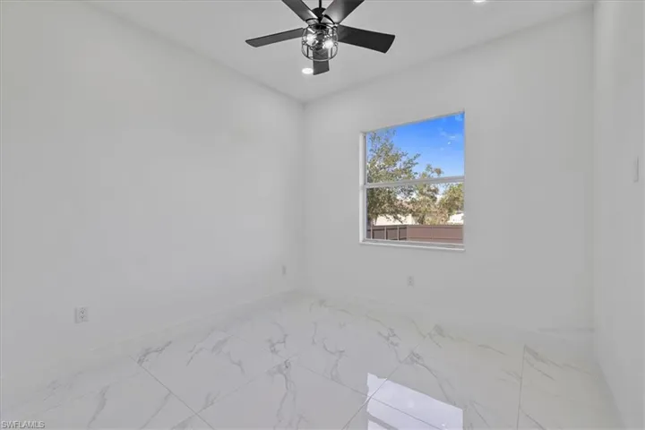 Spare room with recessed lighting and light marble finish floors