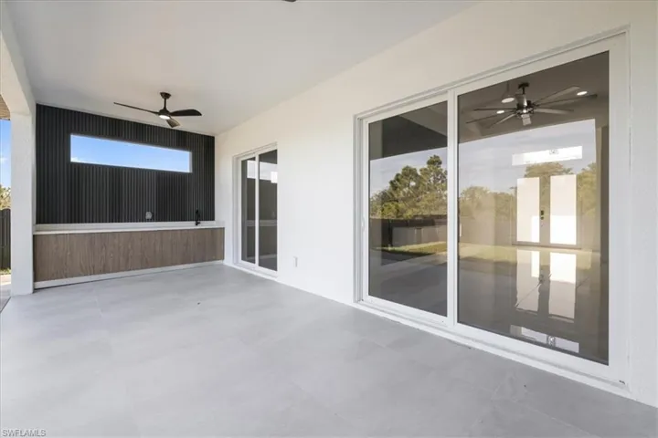View of patio with a ceiling fan