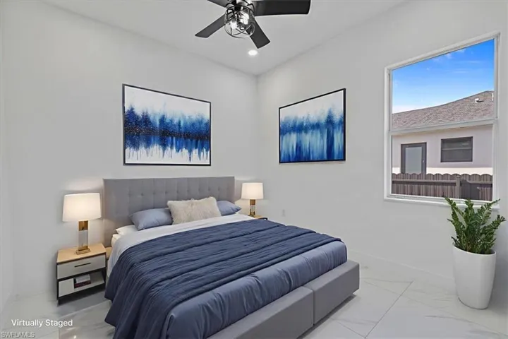 Bedroom featuring a ceiling fan, marble finish flooring, and recessed lighting