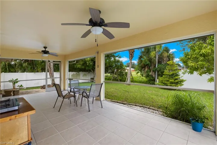 Sunroom featuring ceiling fan