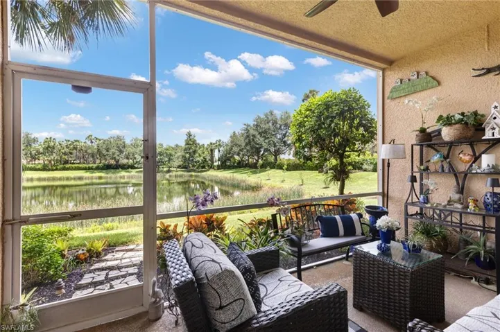 Screened-in outdoor living space with a ceiling fan