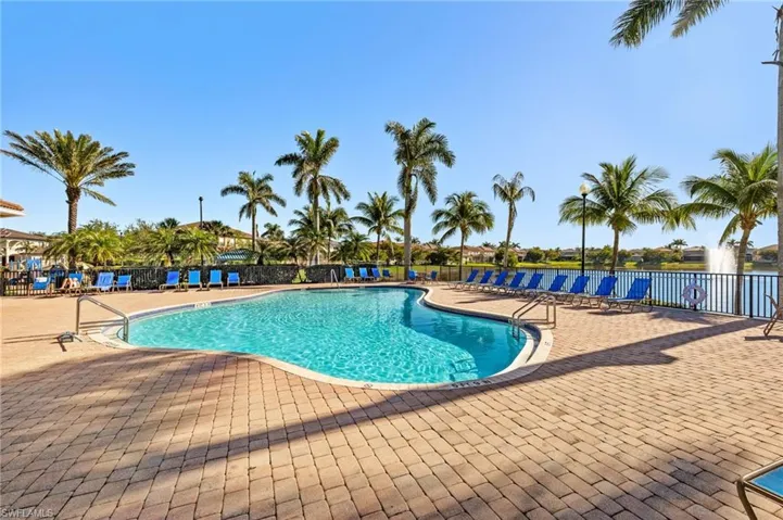 Community pool featuring a patio