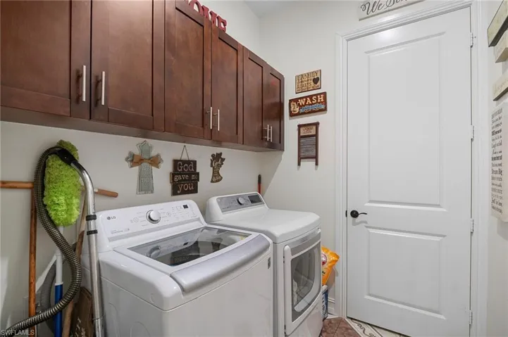 Laundry area with washing machine and dryer and cabinet space