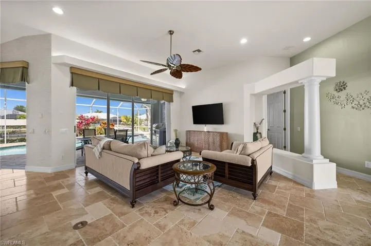 Living Room is steps from the pool