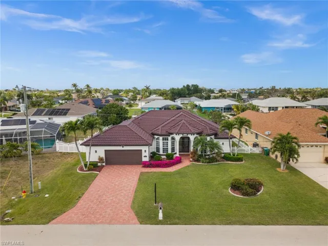 Aerial View showing the Paver Driveway and Lush Tropical Landscaping
