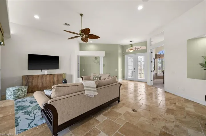 Volume ceilings with custom lighting and Travertine floors