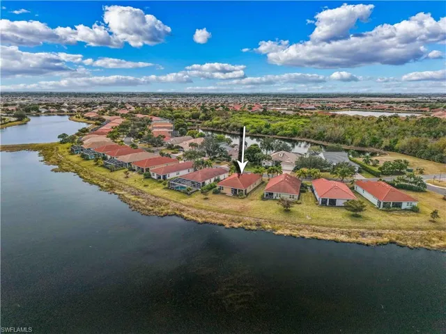 Aerial perspective of suburban area with a large body of water