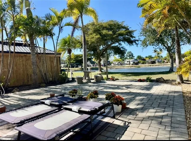 View of patio / terrace with a water view