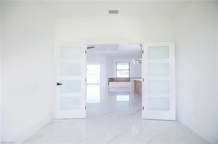 Hall with an inviting chandelier