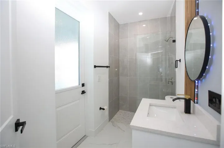 Bathroom with vanity and walk in shower