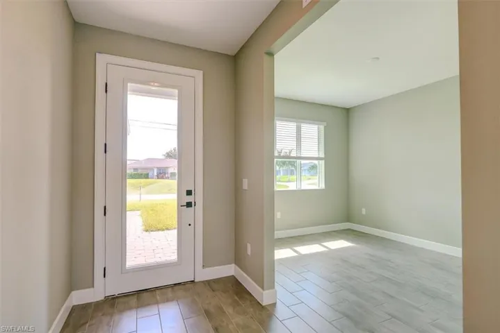 Doorway to outside featuring light hardwood / wood-style floors