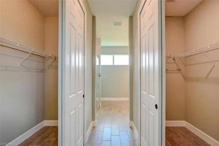 Spacious closet with wood-type flooring