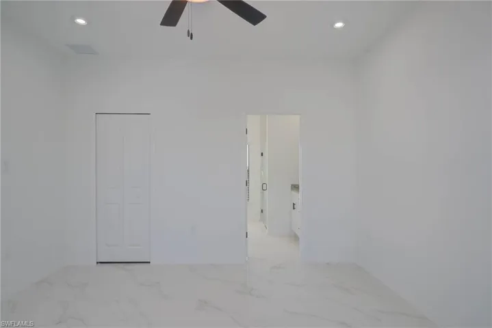 Unfurnished room featuring ceiling fan