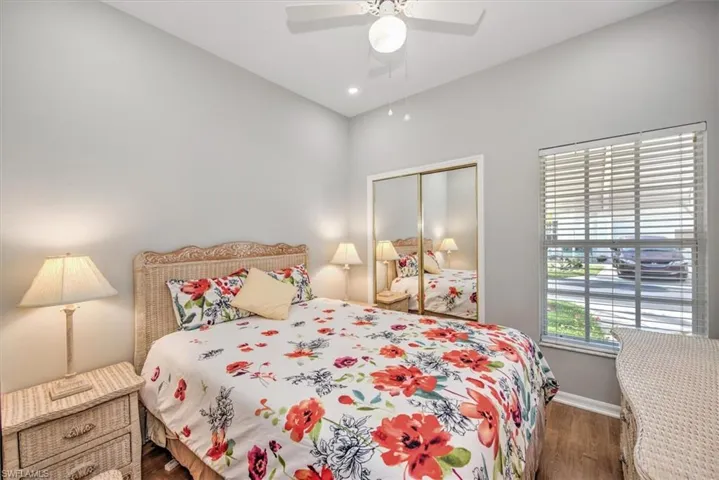 Bedroom featuring a closet, ceiling fan, and dark wood-type flooring