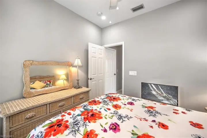 Bedroom with vaulted ceiling and ceiling fan