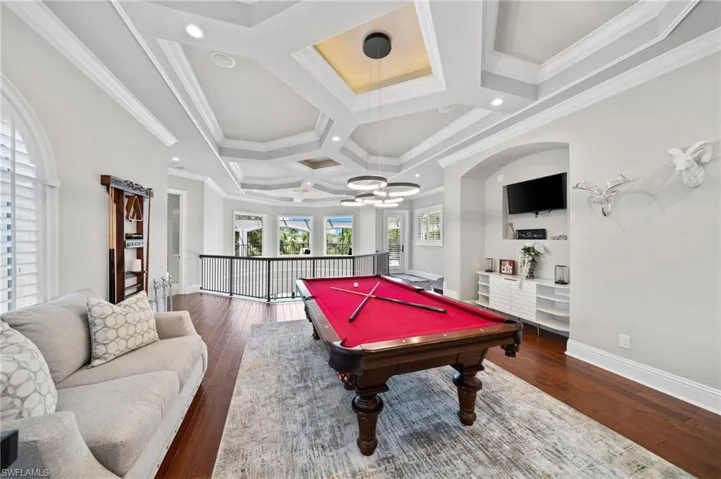 Game room featuring coffered ceiling, hardwood / wood-style floors, recessed lighting, a chandelier, and pool table