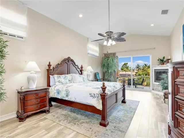 Bedroom featuring vaulted ceiling