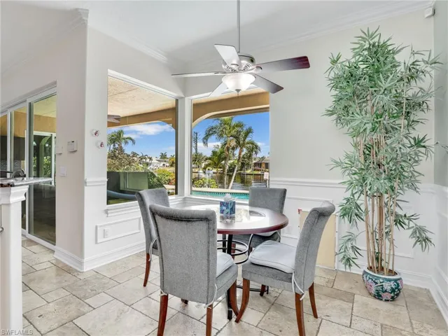 Dining area featuring plenty of natural light, ceiling fan, and light tile floors