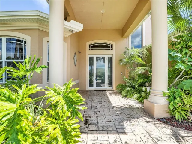 Property entrance with a patio area