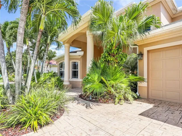 View of exterior entry featuring a garage