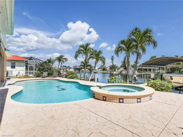 View of pool featuring an in ground hot tub and a patio area