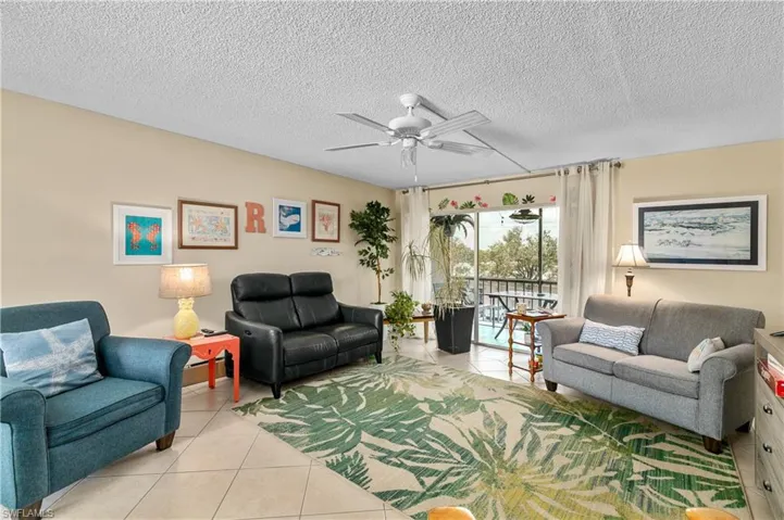 Very large living room with diagonal tiles through out.