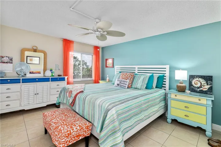 Main Bedroom has such a Beach like feel along with new ceiling fan.