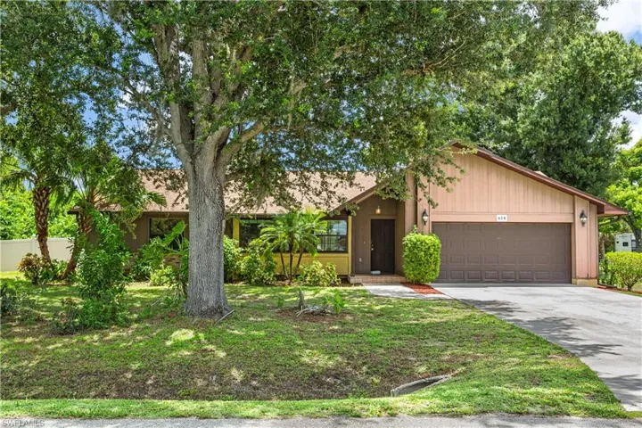 Single story home featuring a garage